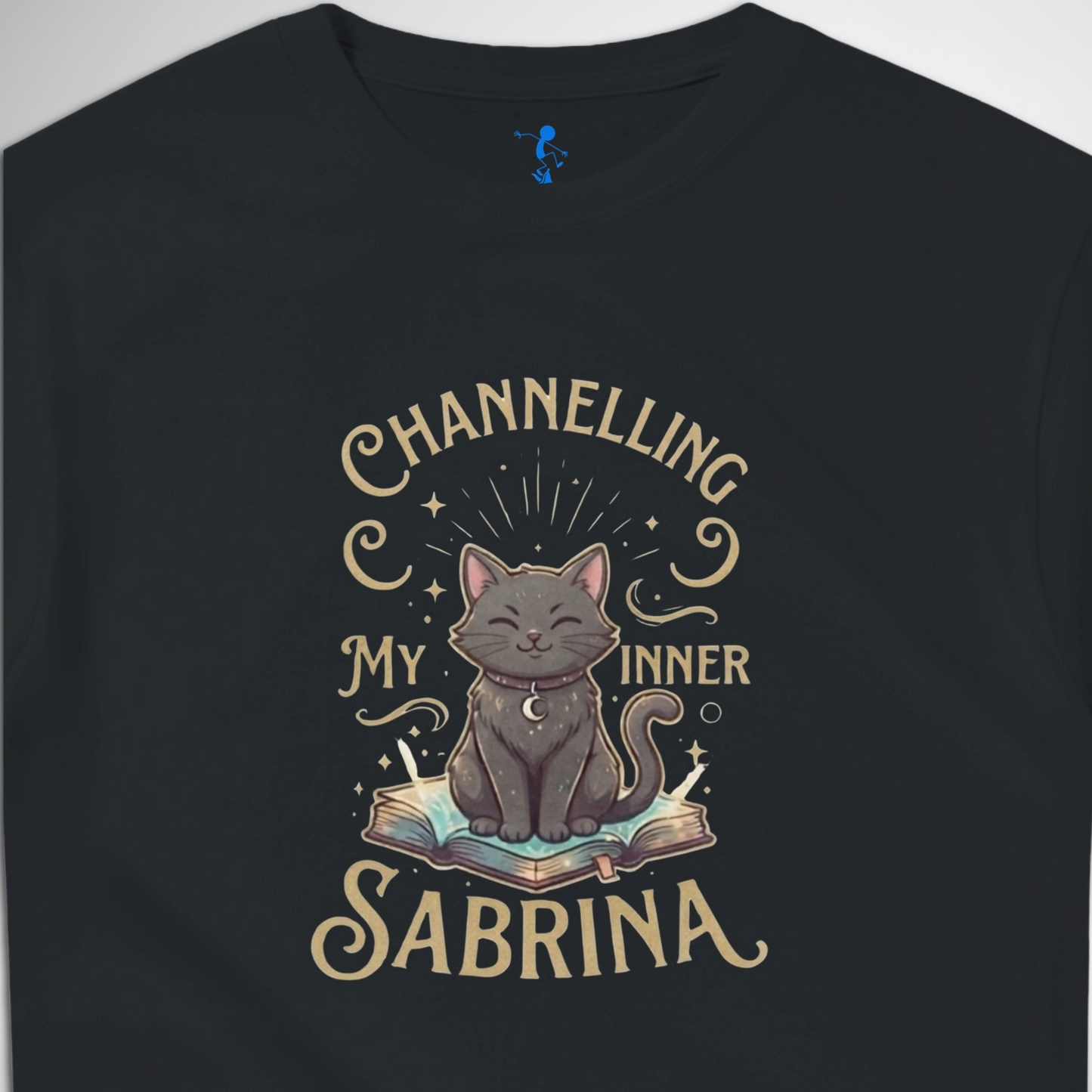 Channelling My Inner Sabrina Halloween t-shirt featuring a magical cat design laid out flat available in red pink, blue, orange, green, black