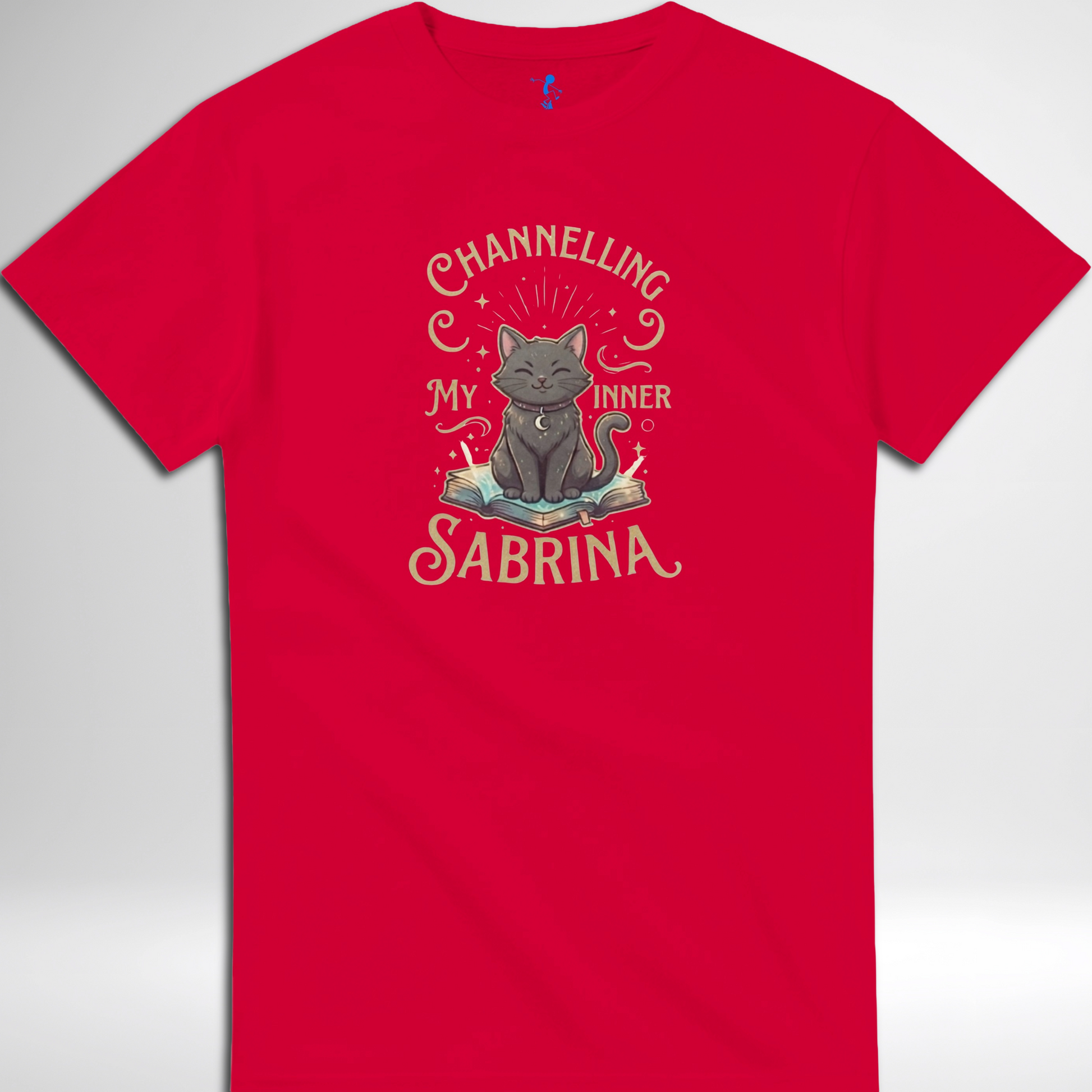 Channelling My Inner Sabrina Halloween t-shirt featuring a magical cat design laid out flat available in red pink, blue, orange, green, black