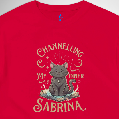 Channelling My Inner Sabrina Halloween t-shirt featuring a magical cat design laid out flat available in red pink, blue, orange, green, black