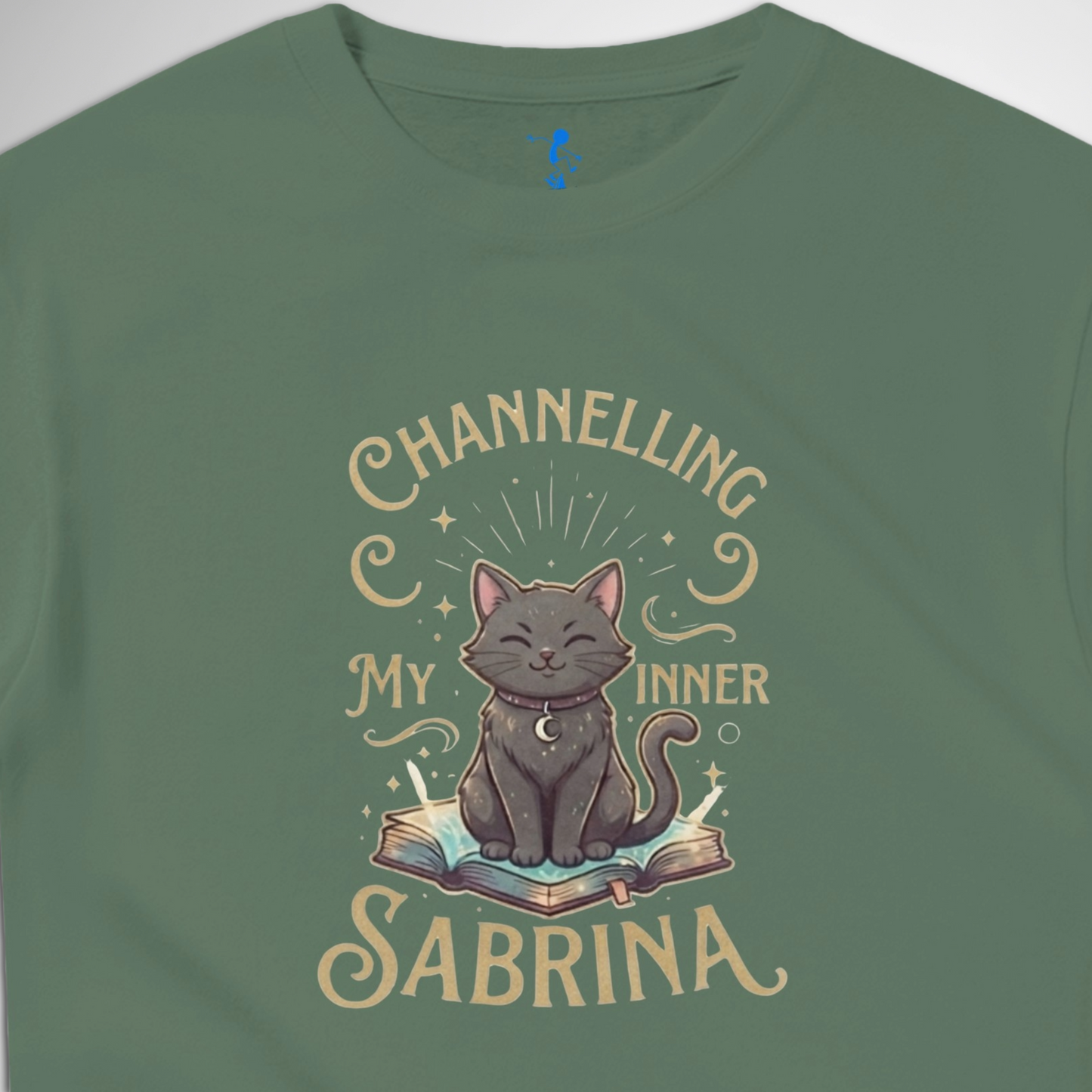 Channelling My Inner Sabrina Halloween t-shirt featuring a magical cat design laid out flat available in red pink, blue, orange, green, black