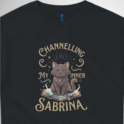 Channelling My Inner Sabrina Halloween t-shirt featuring a magical cat design laid out flat available in red pink, blue, orange, green, black