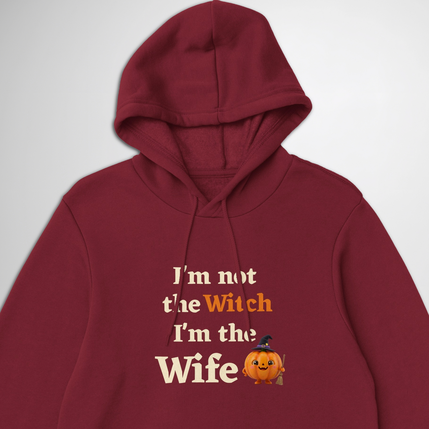 Close up women's I'm Not The Witch I'm The Wife Halloween hoodie available in green, black, navy, maroon, grey